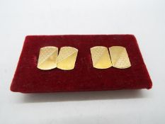 A pair of 9ct gold cufflinks, approximately 3.6 grams all in.