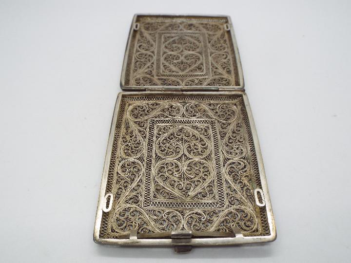 An attractive, white metal, filigree cigarette case 9.5 cm x 7.5 cm, 138 grams all in. - Image 4 of 4