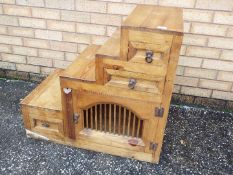 A step cabinet having triple drawers and a cupboard, approximately 72 cm x 77 cm x 45 cm.