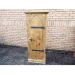 A good quality pine cupboard having single lancet top door, approximately 153 cm x 61 cm x 38 cm.