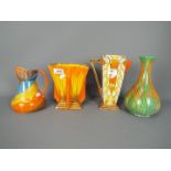A collection of Art Deco ceramics by Wadeheath, comprising vases, jug,