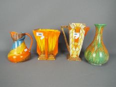 A collection of Art Deco ceramics by Wadeheath, comprising vases, jug,