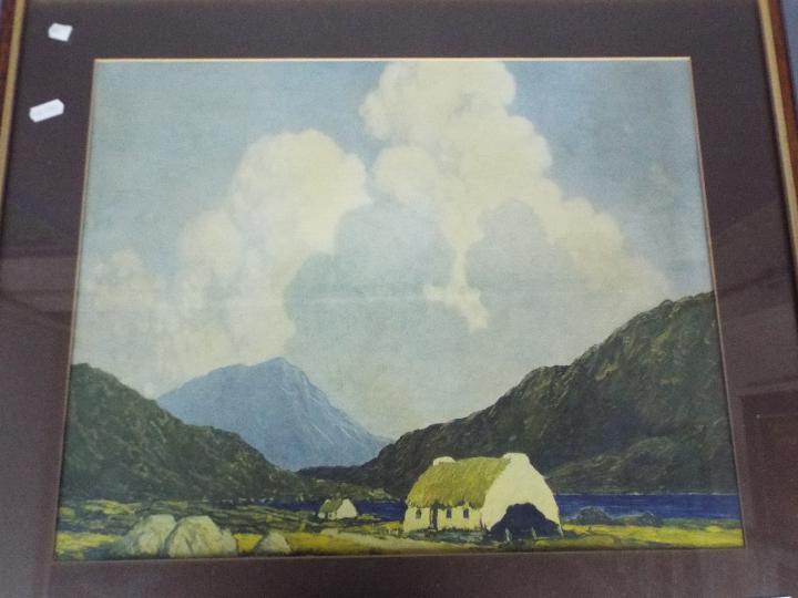 A framed print after Paul Henry, The Blue Lake, Connemara, mounted and framed under glass,