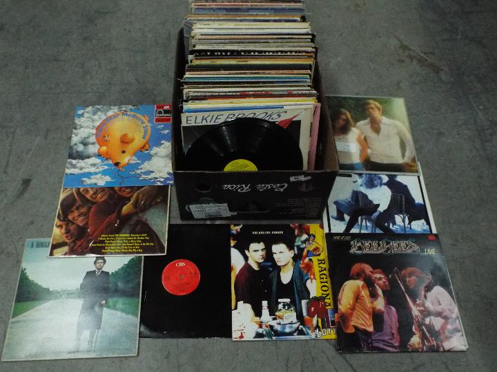 A large box of 12" vinyl records to include Berlin, Hue And Cry, Tina Turner, The Bee Gees, ,