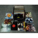 A large box of 12" vinyl records to include Berlin, Hue And Cry, Tina Turner, The Bee Gees, ,