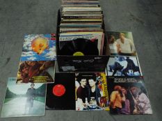 A large box of 12" vinyl records to include Berlin, Hue And Cry, Tina Turner, The Bee Gees, ,