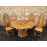 An octagonal topped dining table with metal mounts,