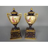 A pair of Vienna style, porcelain twin handled urns and covers decorated with classical scenes,