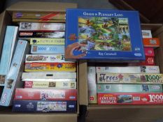 A large quantity of jigsaw puzzles, two
