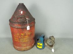 Motoring - A large vintage oil can,