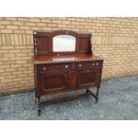 An oak sideboard with mirror back, appro