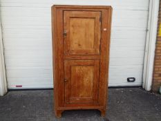 A twin door pine corner cupboard measuri