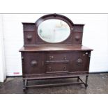 A mirror back, oak sideboard with carved