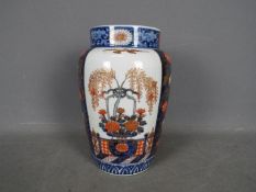 A large vase with floral and foliate dec