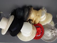 A hat box and a quantity of lady's hats.