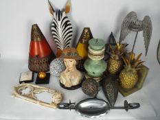 Lot to include candle holders, wall art, bookends and other.