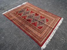 Pakistan - A hand knotted wool carpet,