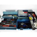 Three tool boxes containing a quantity of hand tools.