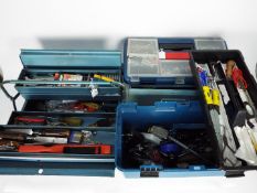 Three tool boxes containing a quantity of hand tools.