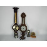 Two banjo barometers and a collection of small clocks.