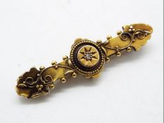 An Edwardian 15ct gold, stone set bar brooch, 4 cm (l), Birmingham 1904, approximately 2.