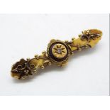 An Edwardian 15ct gold, stone set bar brooch, 4 cm (l), Birmingham 1904, approximately 2.