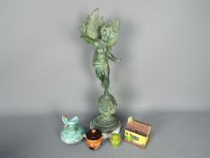 A cast metal sculpture depicting Hymen, set to a marble base,
