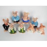 A set of eight Natwest pig money banks.