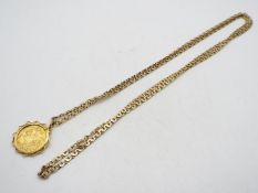 An Edward VII half sovereign, 1902, in yellow metal mount on 9ct gold chain (78 cm length),