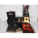 A quantity of vintage sheet music, two guitar carry cases and a boxed ukulele.