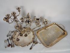 A collection of plated ware to include coffee set, trays, flatware and similar.