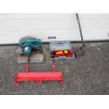 A quantity of tools to include a chop saw, trolley jack, Clarke Strong-Arm metal folder and other.