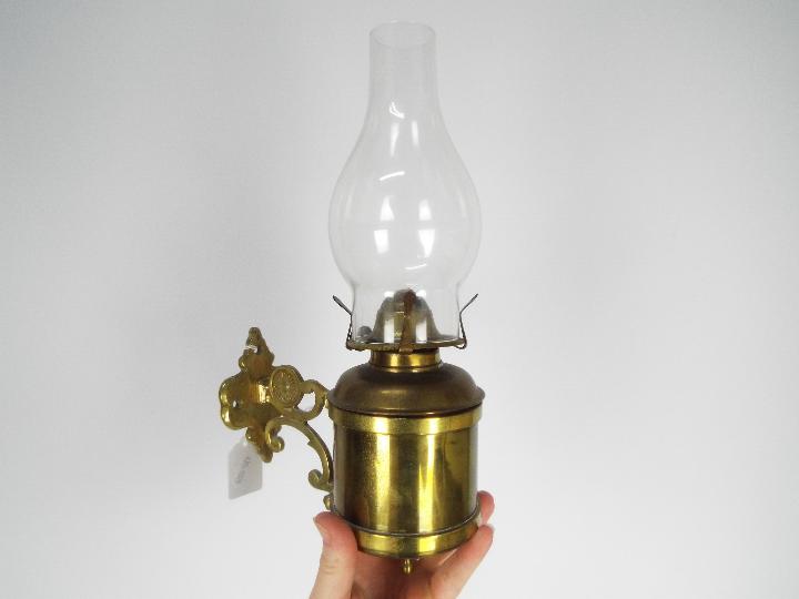 Two brass oil lamps, one with wall mount, largest approximately 40 cm (h) including chimney. - Image 3 of 5