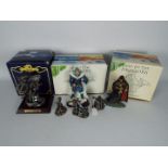 Three boxed figurines by Tudor Mint,