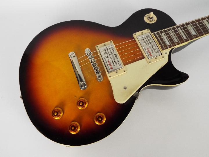 An Epiphone Les Paul Standard electric guitar, Vintage Sunburst, contained in carry case. - Image 2 of 7