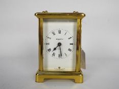 A 20th century French carriage clock by Bayard, white enamel dial with Roman numerals,