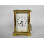 A 20th century French carriage clock by Bayard, white enamel dial with Roman numerals,