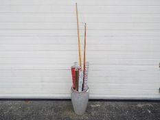 A large ceramic vase, six rolls of Christmas wrapping paper, a Riley snooker cue and a pool cue.