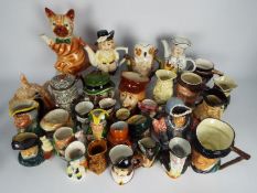 A good collection of novelty teapots, character jugs and Toby jugs, two boxes.