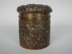 An Edward VII silver powder box with floral and foliate repousse decoration, Birmingham assay 1903,