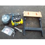 A Wolf Baby Cub air compressor and a Black & Decker Workmate.