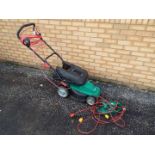 A Qualcast 1400w Electric Rotary Lawnmower and a Hedge Master hedge trimmer.