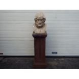 A ceramic bust of Homer on a stone effect plinth, approximately 137 cm (h).