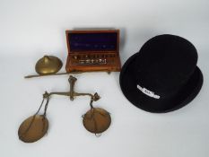 A vintage set of brass scales, good quality set of weights in wooden case and a W Redwood,