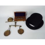 A vintage set of brass scales, good quality set of weights in wooden case and a W Redwood,