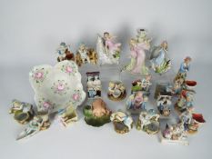 A collection of German porcelain figurines and similar to include centrepiece, fairings,