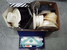 A Masonic regalia case with contents and a hat box and a quantity of lady's hats.