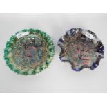 Two carnival glass bowls one Grape And Cable pattern the other Peacocks On A Fence,