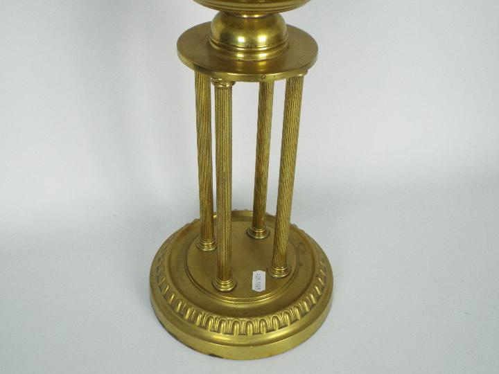 A brass oil lamp on circular base with four column supports, the shade decorated with game birds, - Image 4 of 11