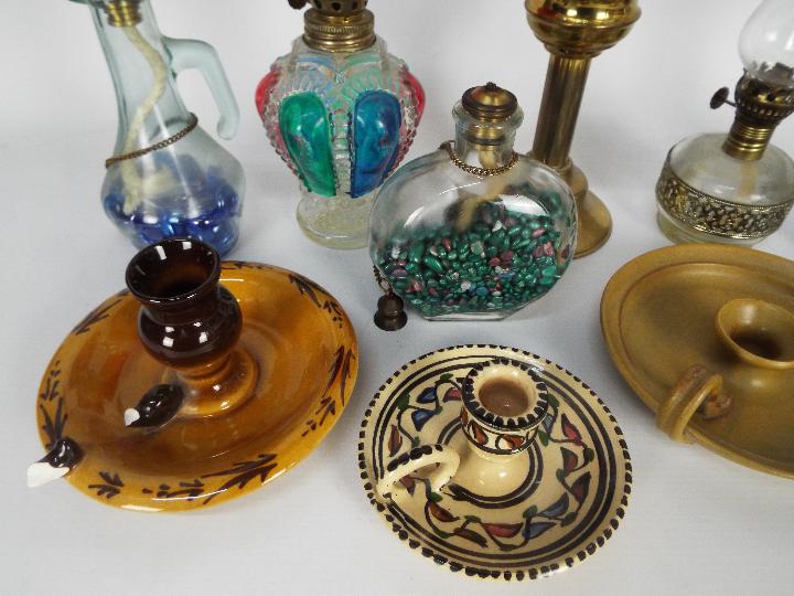 A collection of oil lamps, candle stands, chambersticks, largest approximately 28 cm (h). - Image 4 of 5